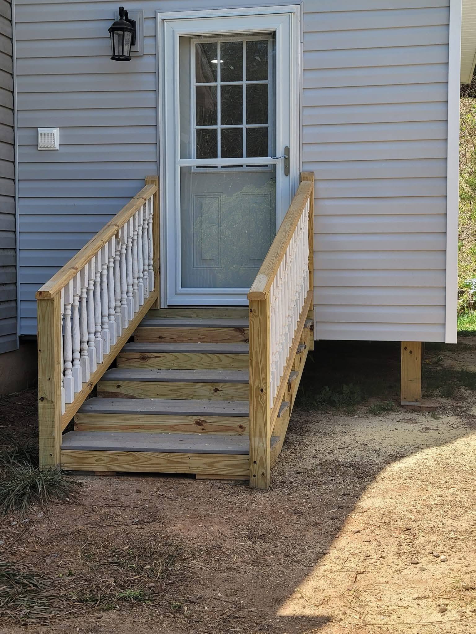 Entry stair with painted spindle railings