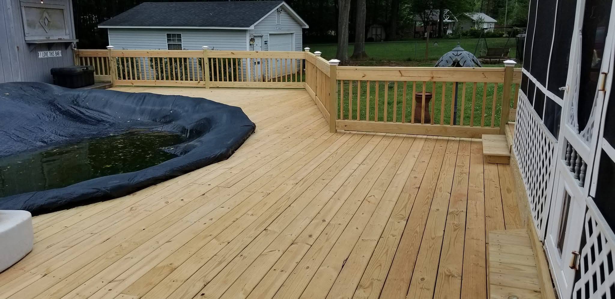 Pool deck with cap rail and post cap lighting